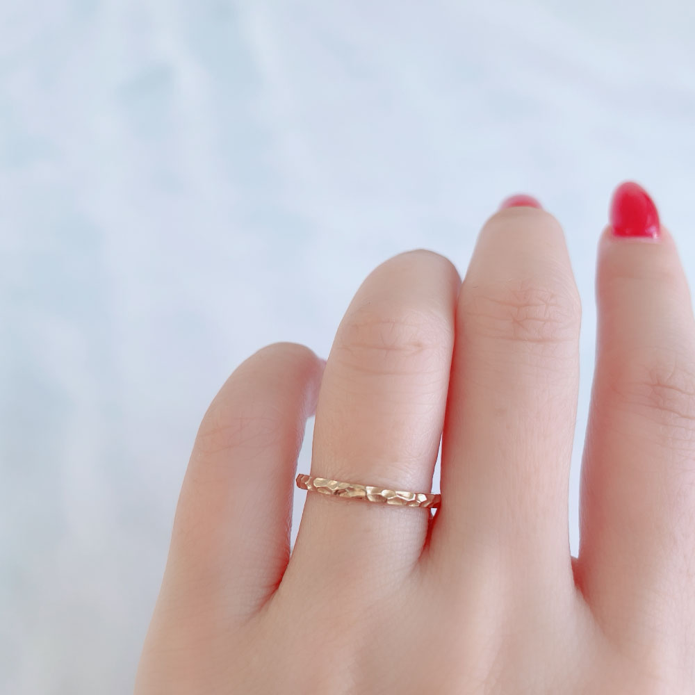 Wedding band （wedding ring）worn on hand in posed still image for styling display