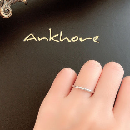 Wedding band （wedding ring）worn on hand in posed still image for styling display