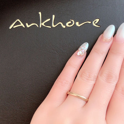 Wedding band （wedding ring）worn on hand in posed still image for styling display