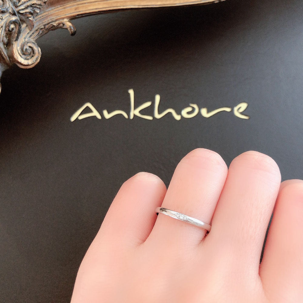 Wedding band （wedding ring）worn on hand in posed still image for styling display