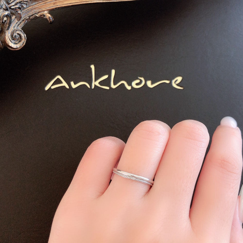 Wedding band （wedding ring）worn on hand in posed still image for styling display