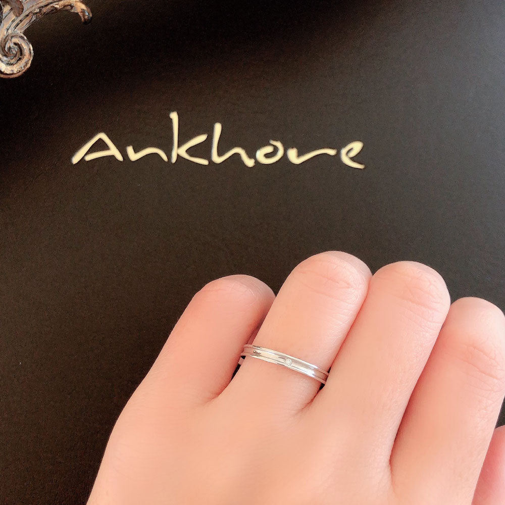 Wedding band （wedding ring）worn on hand in posed still image for styling display