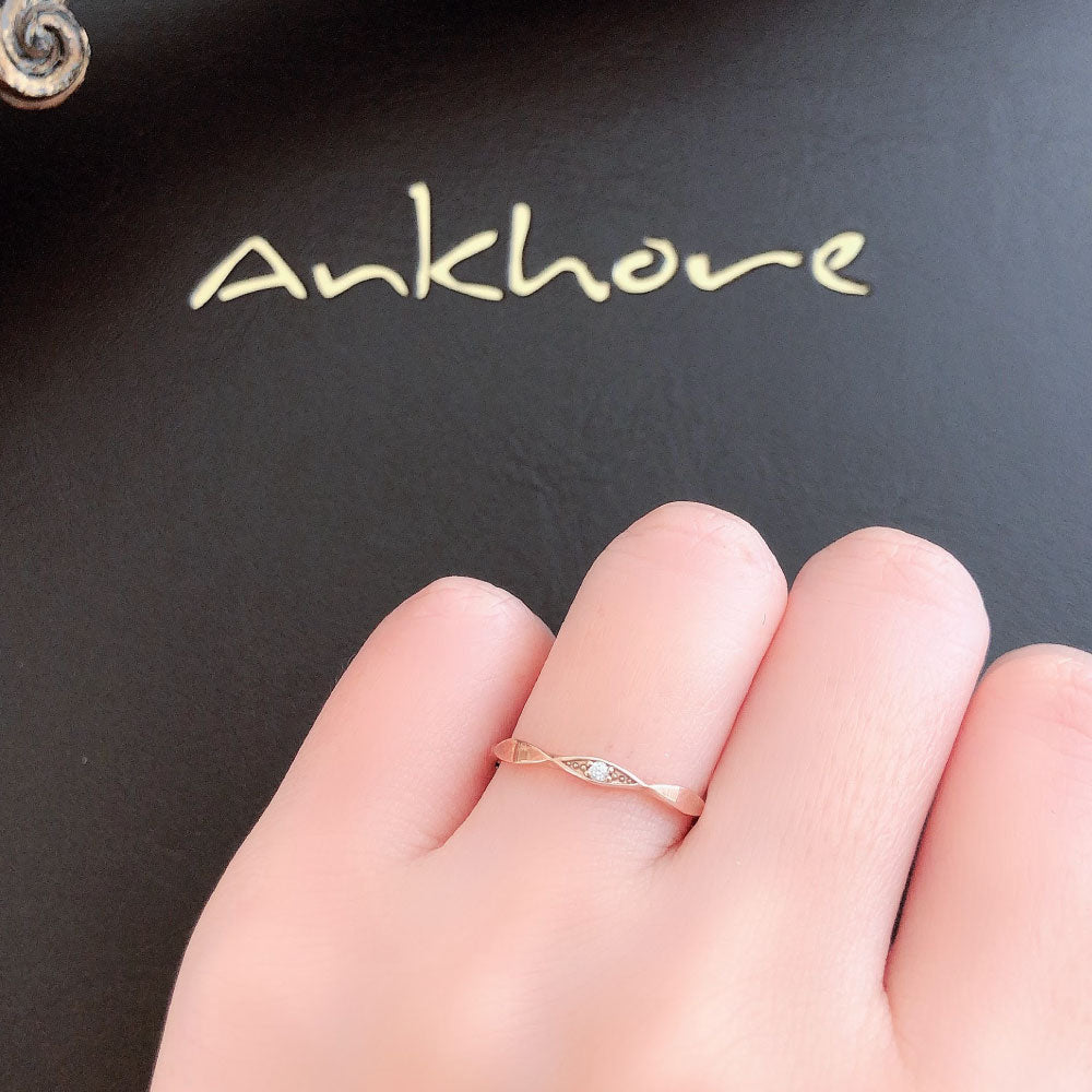 Wedding band （wedding ring）worn on hand in posed still image for styling display