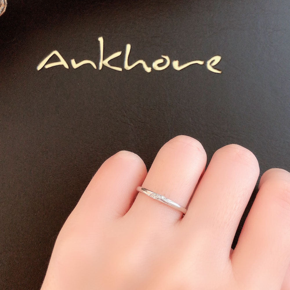 Wedding band （wedding ring）worn on hand in posed still image for styling display
