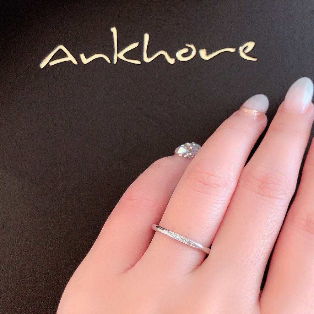 Wedding band （wedding ring）worn on hand in posed still image for styling display