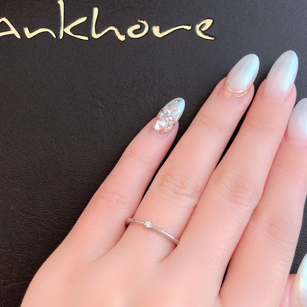 Wedding band （wedding ring）worn on hand in posed still image for styling display
