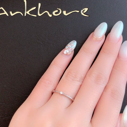 Wedding band （wedding ring）worn on hand in posed still image for styling display