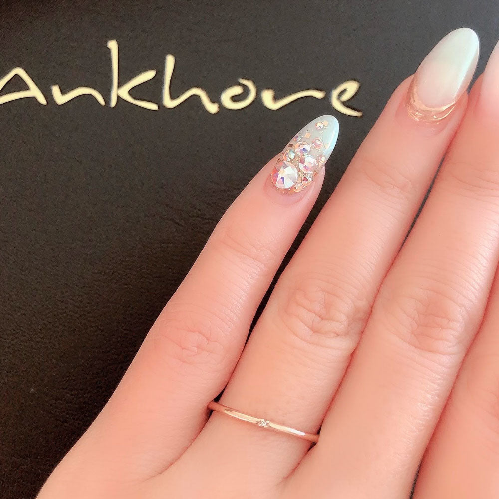Wedding band （wedding ring）worn on hand in posed still image for styling display