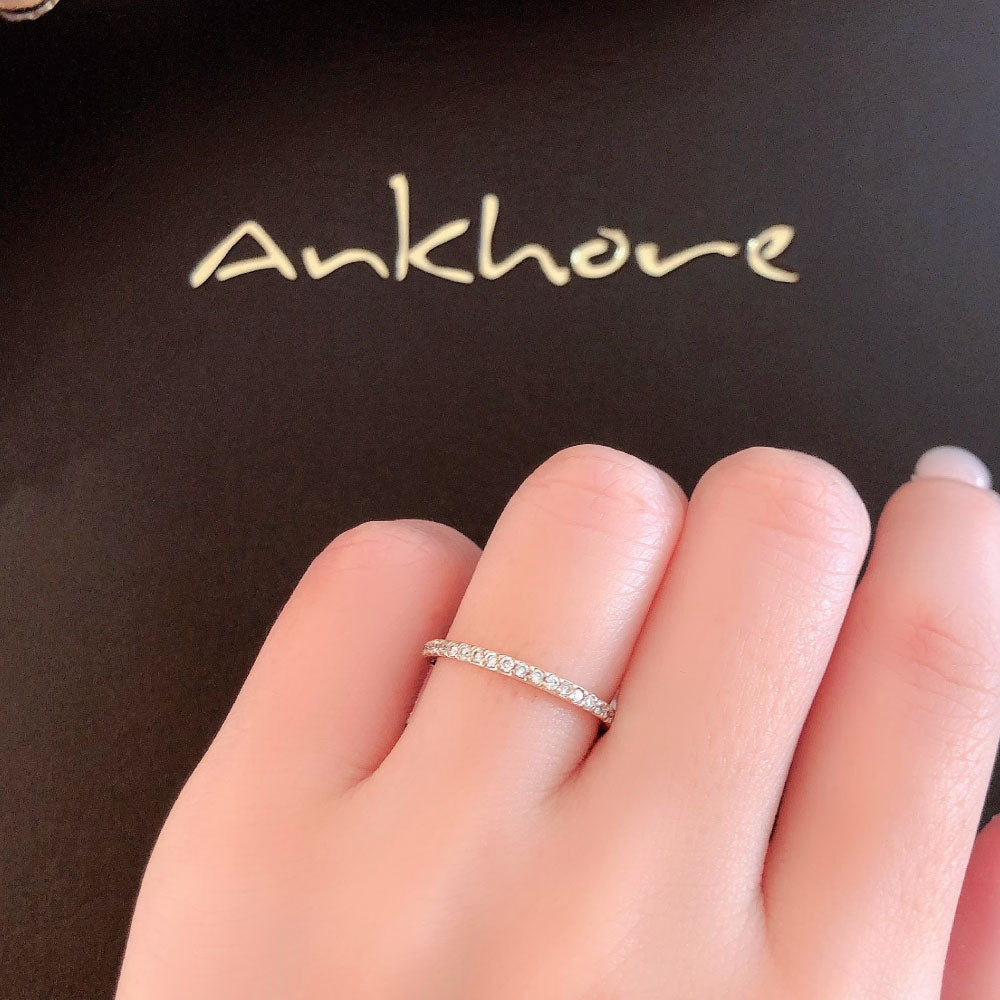 Wedding band （wedding ring）worn on hand in posed still image for styling display