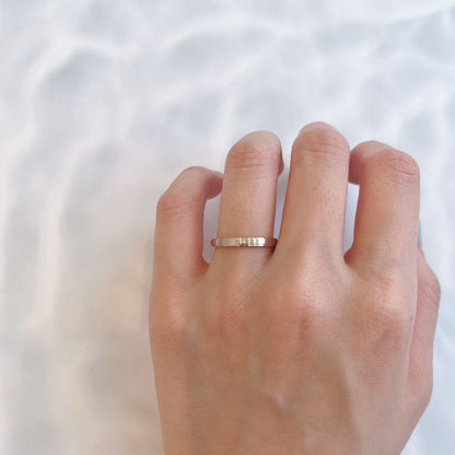 Wedding band （wedding ring）worn on hand in posed still image for styling display