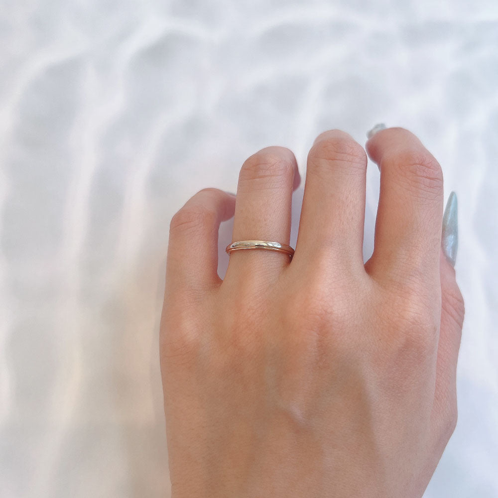 Wedding band （wedding ring）worn on hand in posed still image for styling display