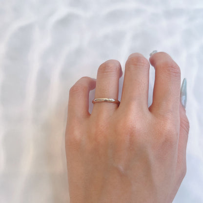 Wedding band （wedding ring）worn on hand in posed still image for styling display