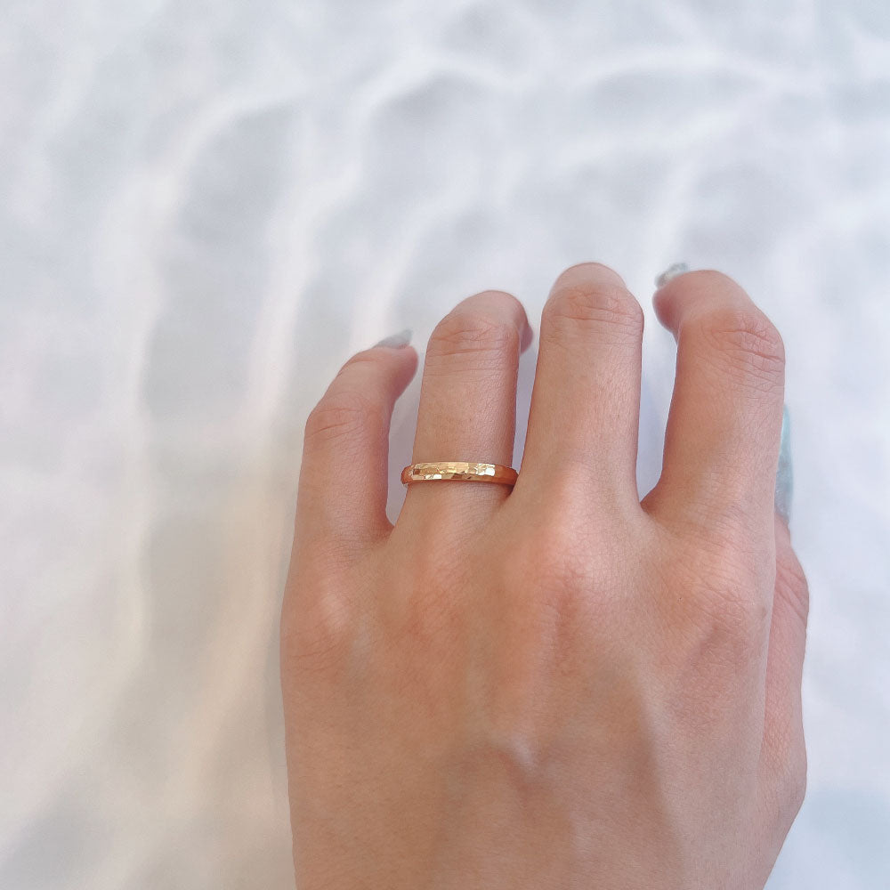 Wedding band （wedding ring）worn on hand in posed still image for styling display