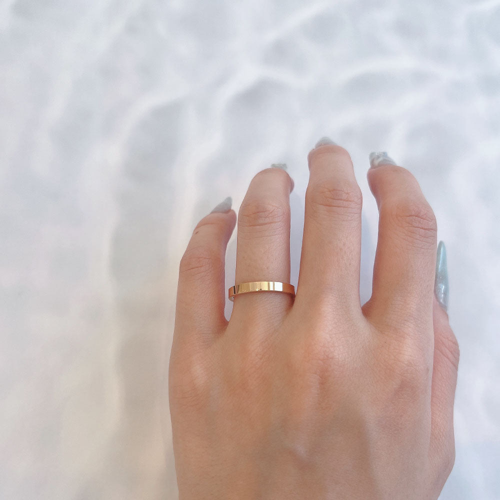 Wedding band （wedding ring）worn on hand in posed still image for styling display