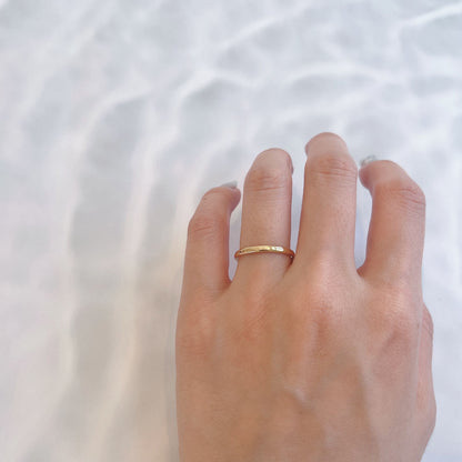Wedding band （wedding ring）worn on hand in posed still image for styling display