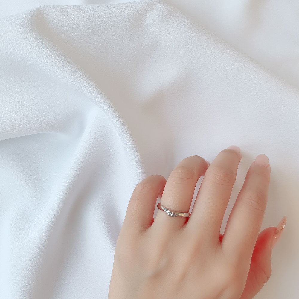Wedding band （wedding ring）worn on hand in posed still image for styling display