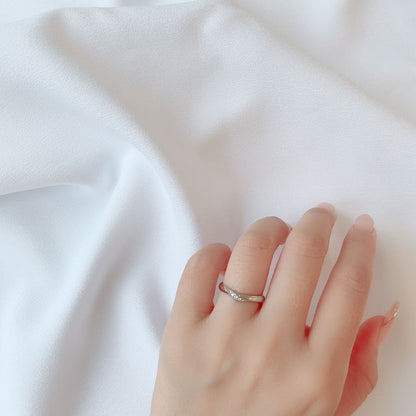 Wedding band （wedding ring）worn on hand in posed still image for styling display