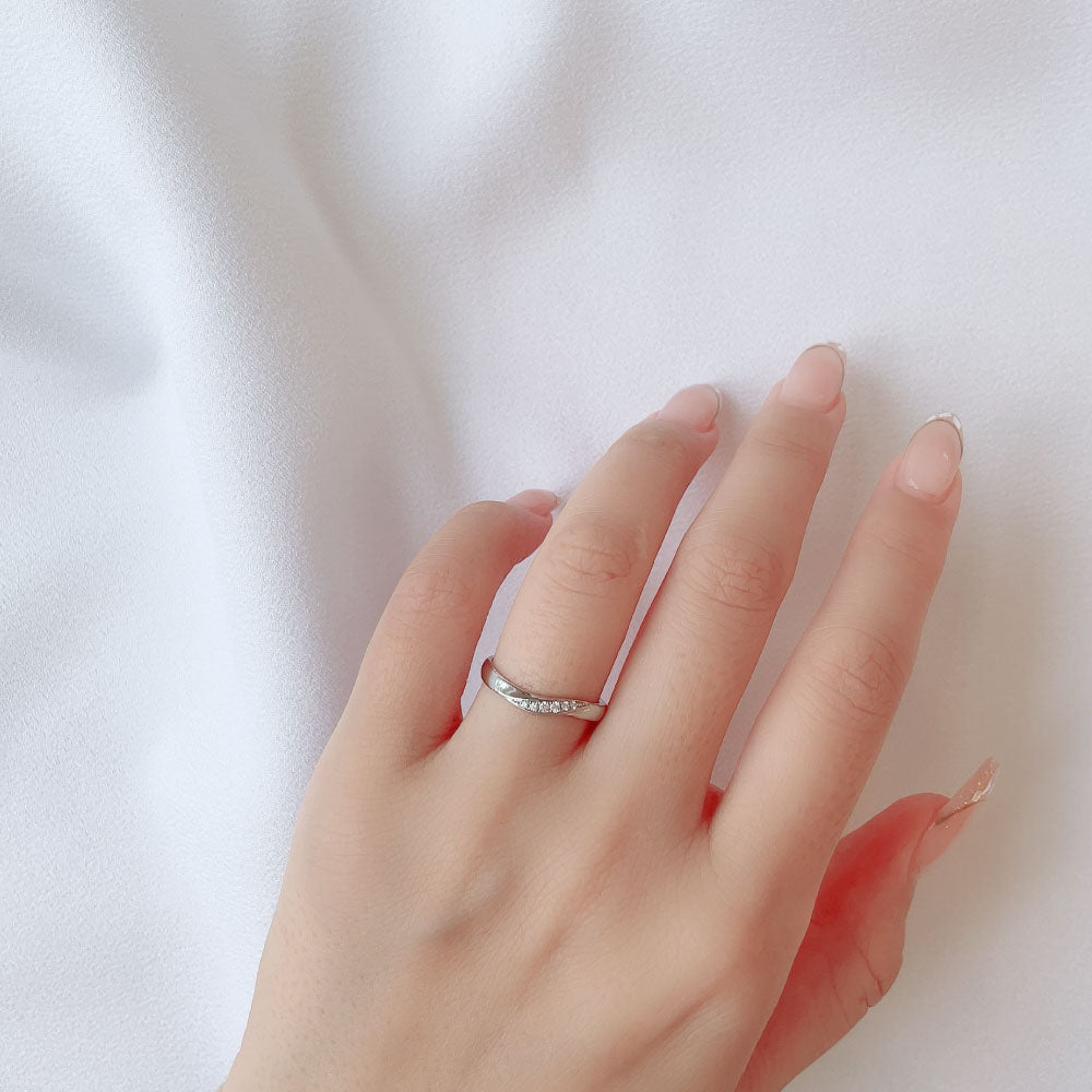 Wedding band （wedding ring）worn on hand in posed still image for styling display