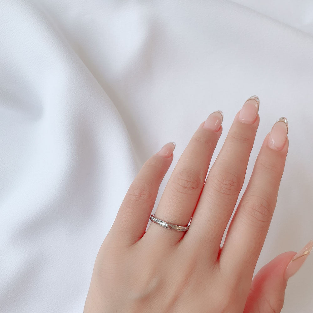 Wedding band （wedding ring）worn on hand in posed still image for styling display