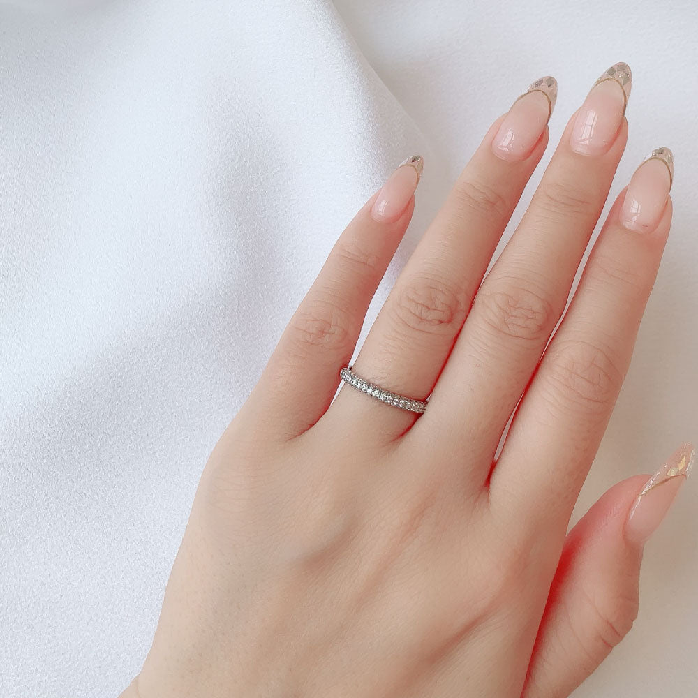 Wedding band （wedding ring）worn on hand in posed still image for styling display