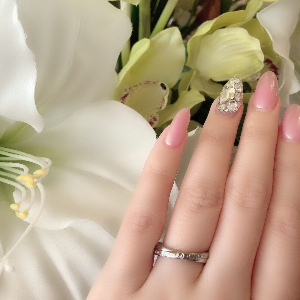Wedding band （wedding ring）worn on hand in posed still image for styling display