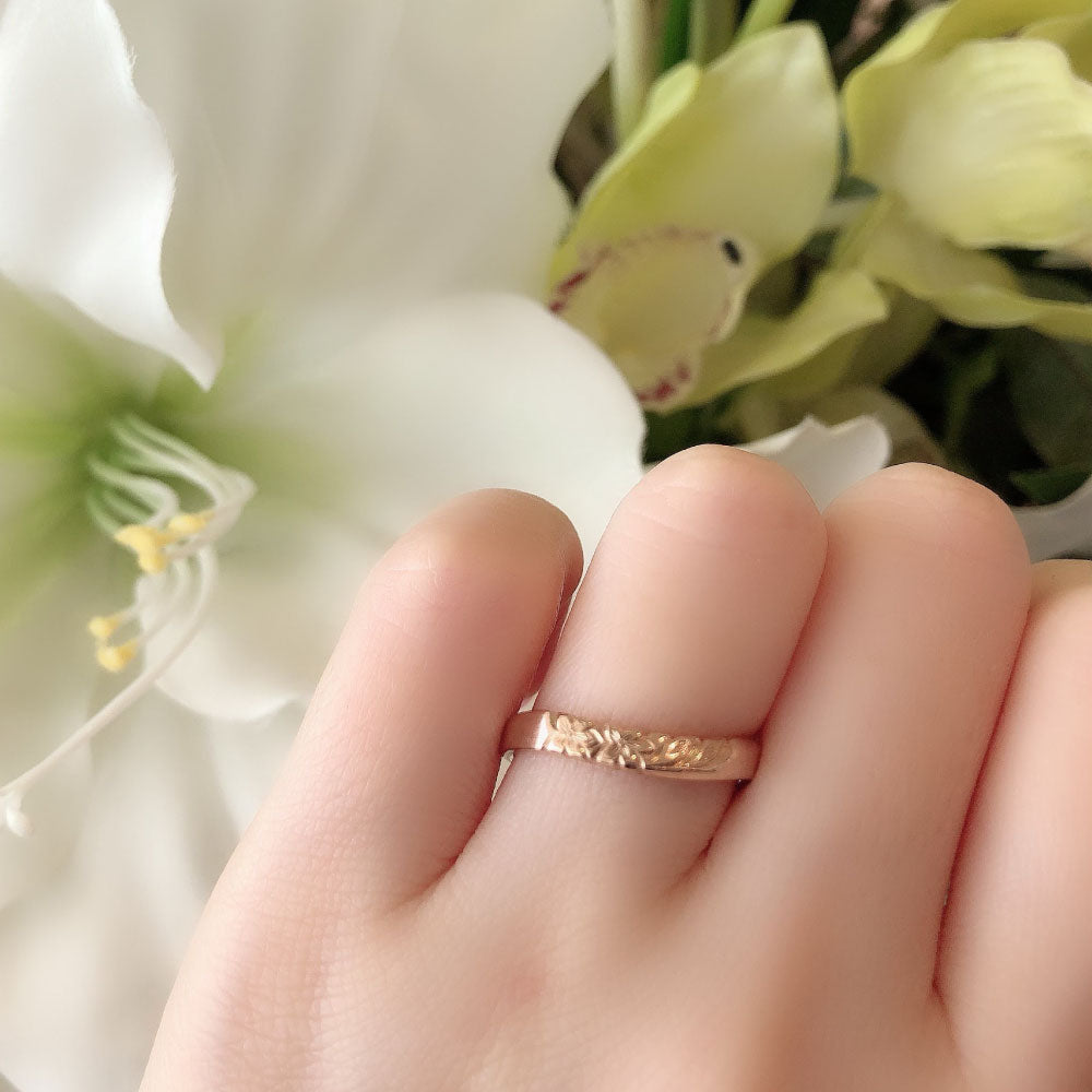 Wedding band （wedding ring）worn on hand in posed still image for styling display