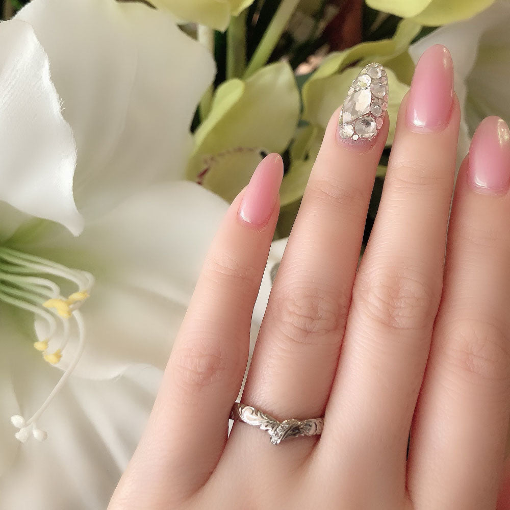 Wedding band （wedding ring）worn on hand in posed still image for styling display