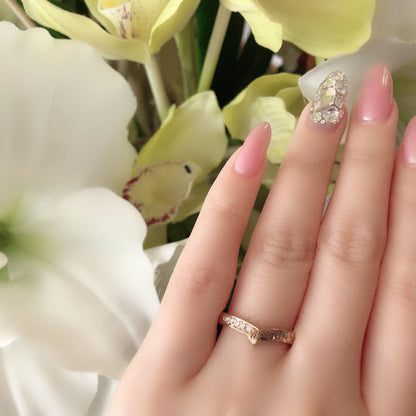 Wedding band （wedding ring）worn on hand in posed still image for styling display