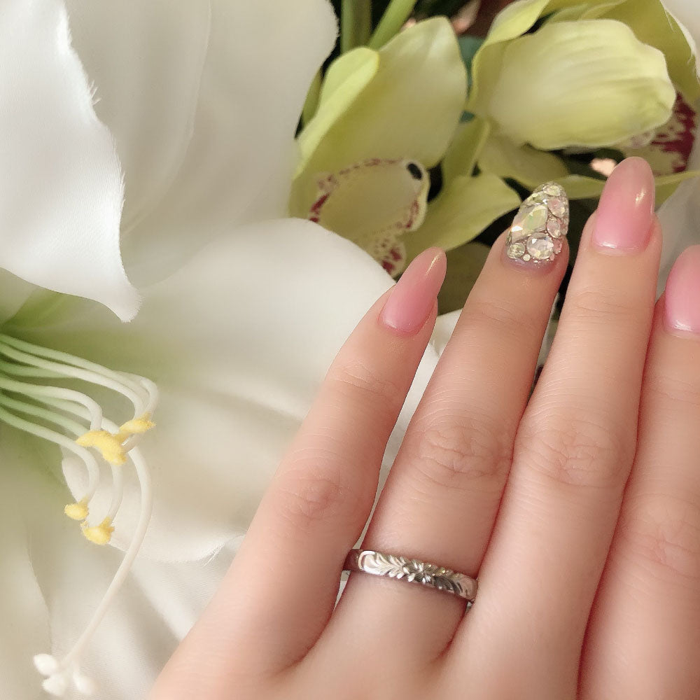 Wedding band （wedding ring）worn on hand in posed still image for styling display