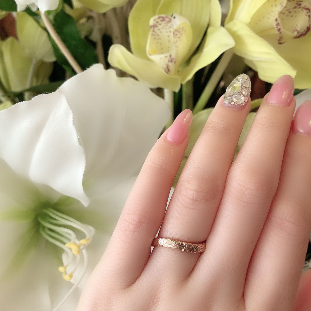 Wedding band （wedding ring）worn on hand in posed still image for styling display