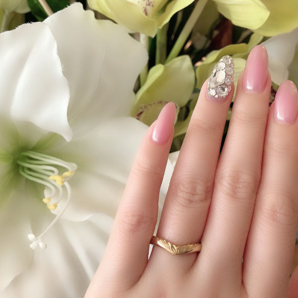 Wedding band （wedding ring）worn on hand in posed still image for styling display