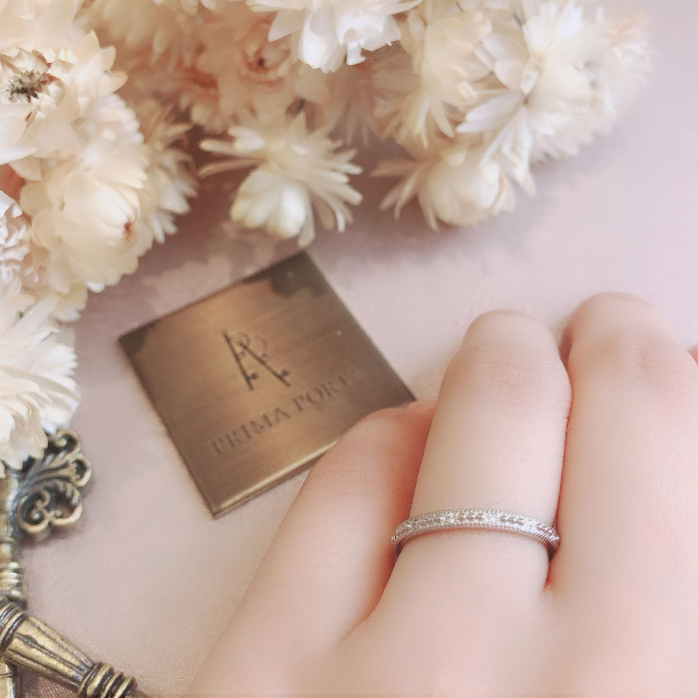 Wedding band （wedding ring）worn on hand in posed still image for styling display