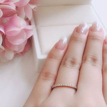 Wedding band （wedding ring）worn on hand in posed still image for styling display
